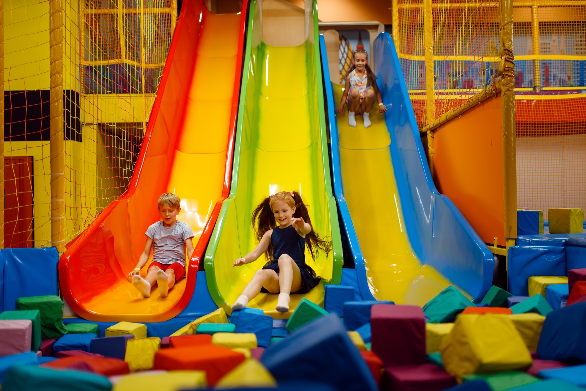 Little children having fun on inflatable slide